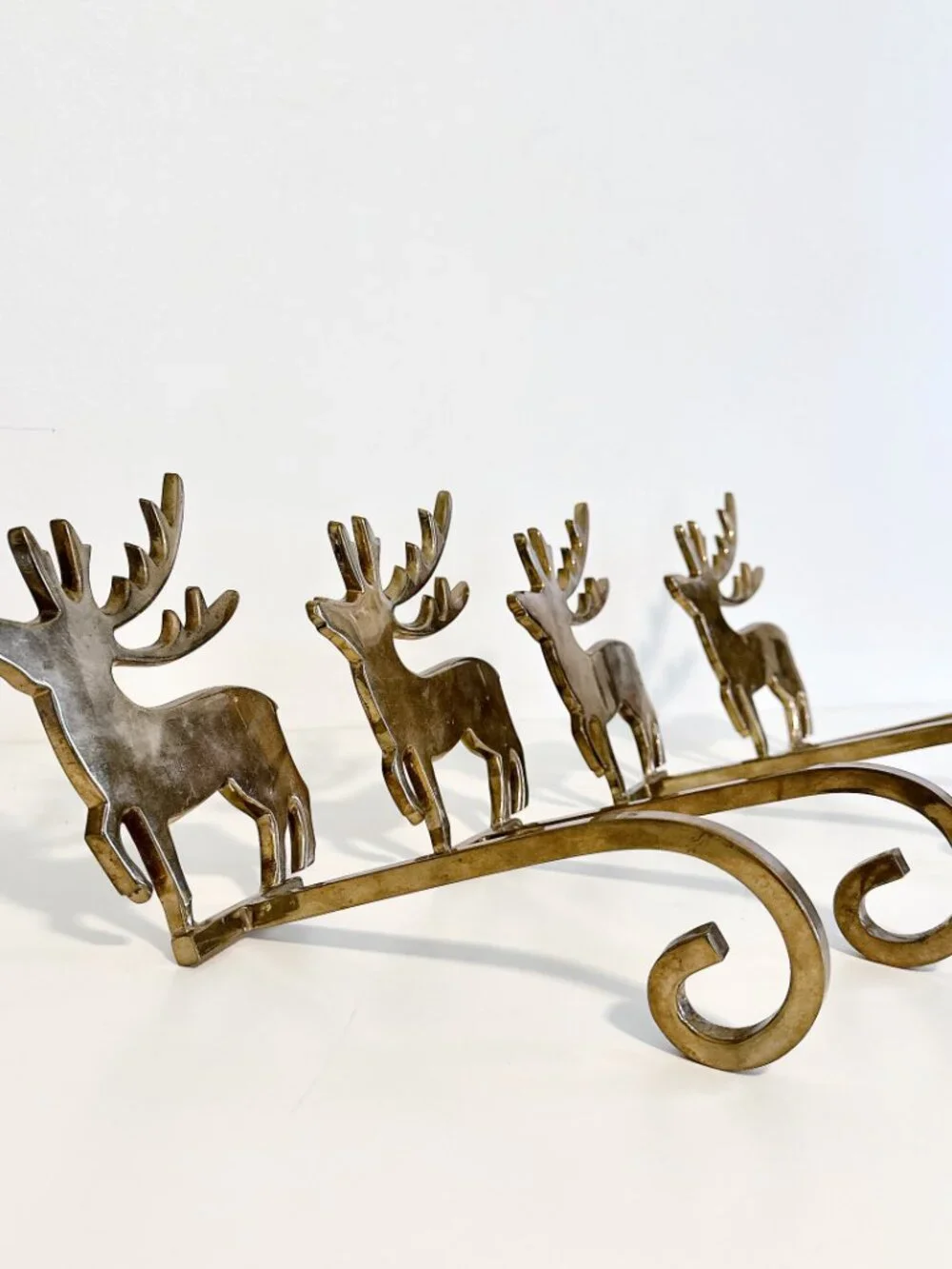 SET OF FOUR BRASS REINDEER MANTEL STOCKING HANGERS